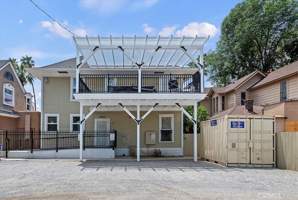 3845 Tenth Street Riverside, CA 92501 - Photo 41 of 45 a view of a white house with large windows