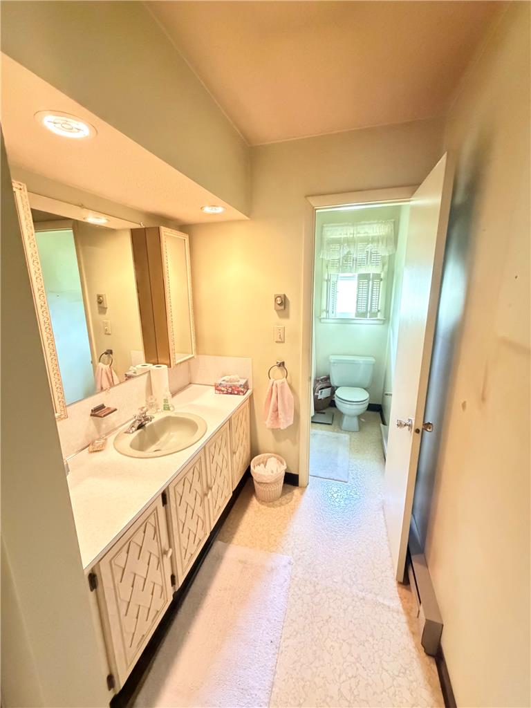5963 Valley Road Slatington, PA 18080 - Photo 9 of 20 Functional vanity and bright mirror illuminate this well-maintained bathroom.