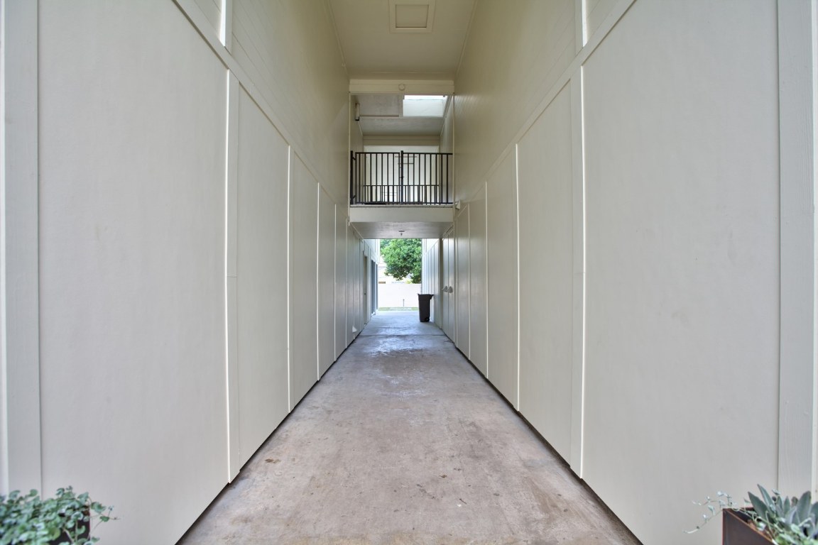 924 East 51st Street, Unit 108 Austin, TX 78751 - Photo 16 of 30 a view of a hallway with wooden floor and windows