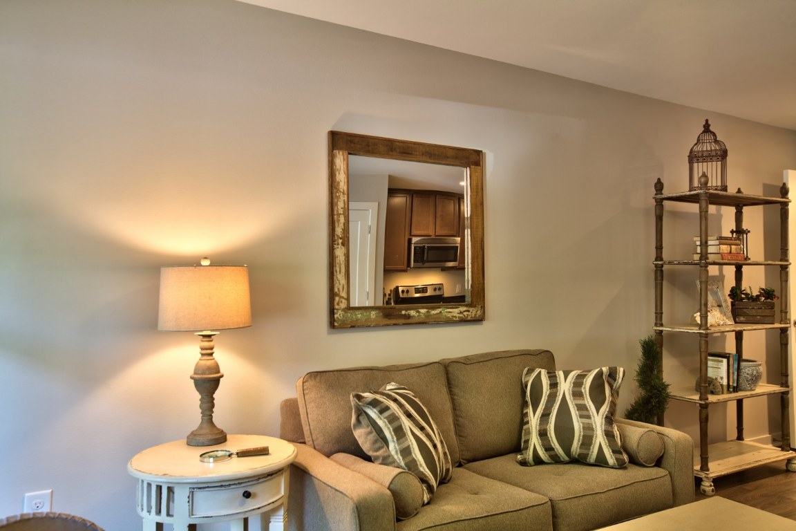 924 East 51st Street, Unit 108 Austin, TX 78751 - Photo 21 of 30 a living room with furniture and a lamp