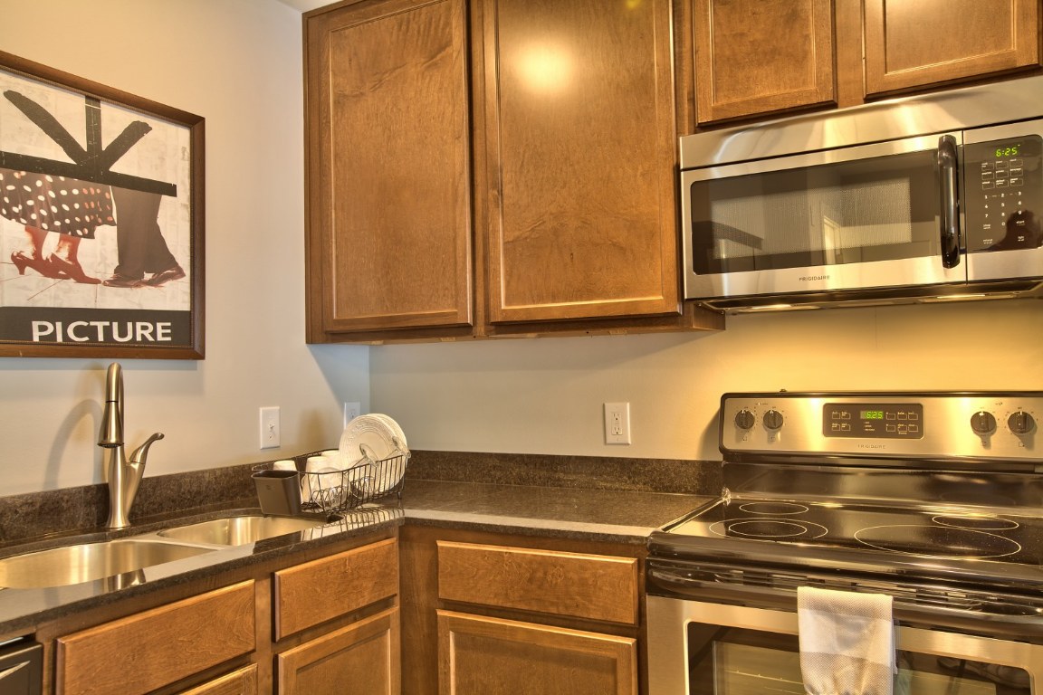 924 East 51st Street, Unit 108 Austin, TX 78751 - Photo 22 of 30 a kitchen with a sink and cabinets