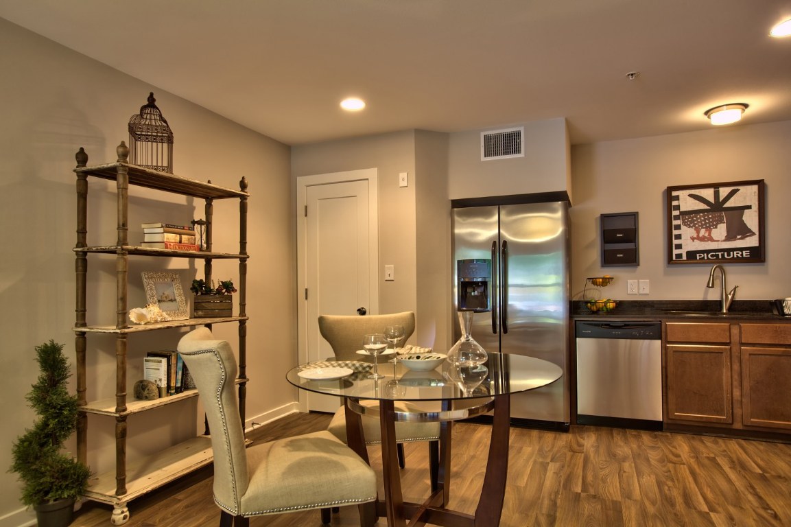 924 East 51st Street, Unit 108 Austin, TX 78751 - Photo 24 of 30 a kitchen with stainless steel appliances granite countertop a stove and cabinets