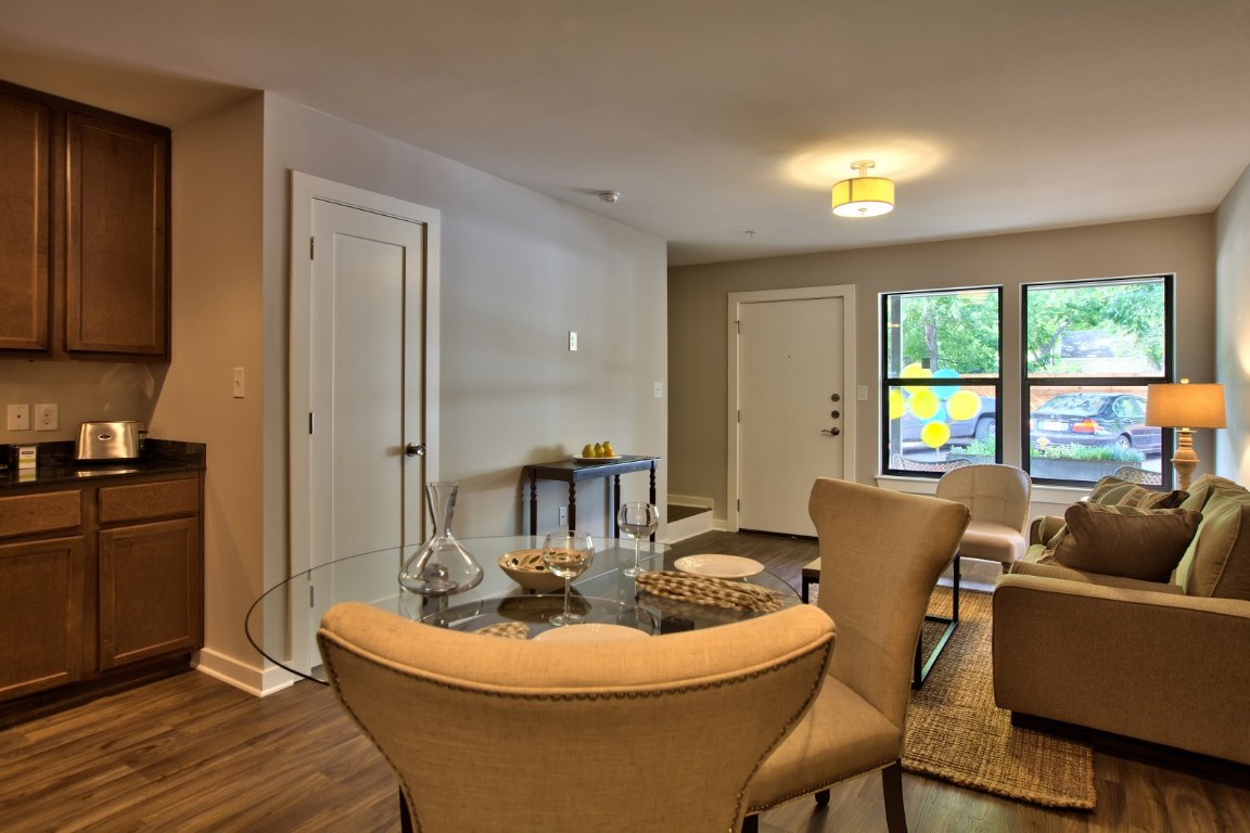 924 East 51st Street, Unit 108 Austin, TX 78751 - Photo 3 of 30 a living room with furniture a window and a dining table