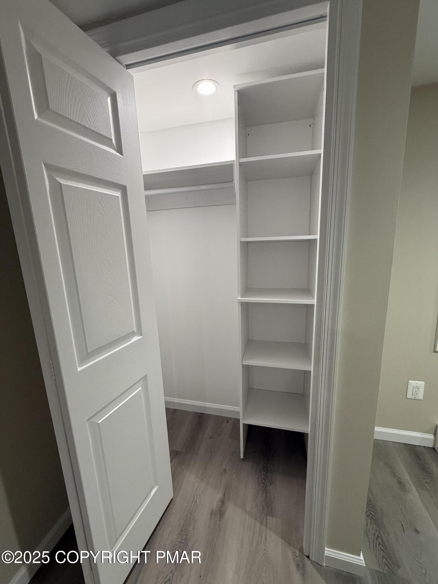 1114 Mill Street, Unit 2 Tobyhanna, PA 18466 - Photo 12 of 21 a view of walk in closet with empty racks