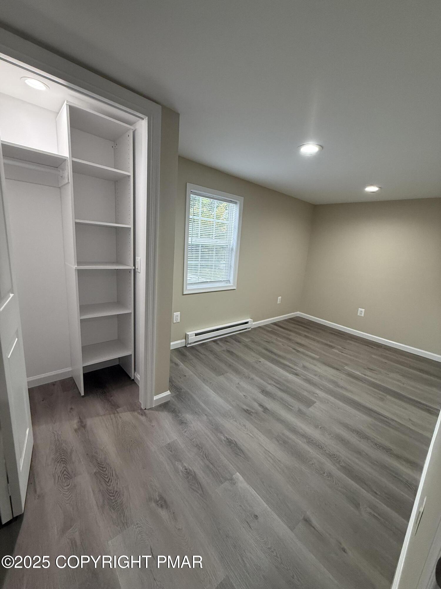 1114 Mill Street, Unit 2 Tobyhanna, PA 18466 - Photo 13 of 21 a view of an empty room with a window