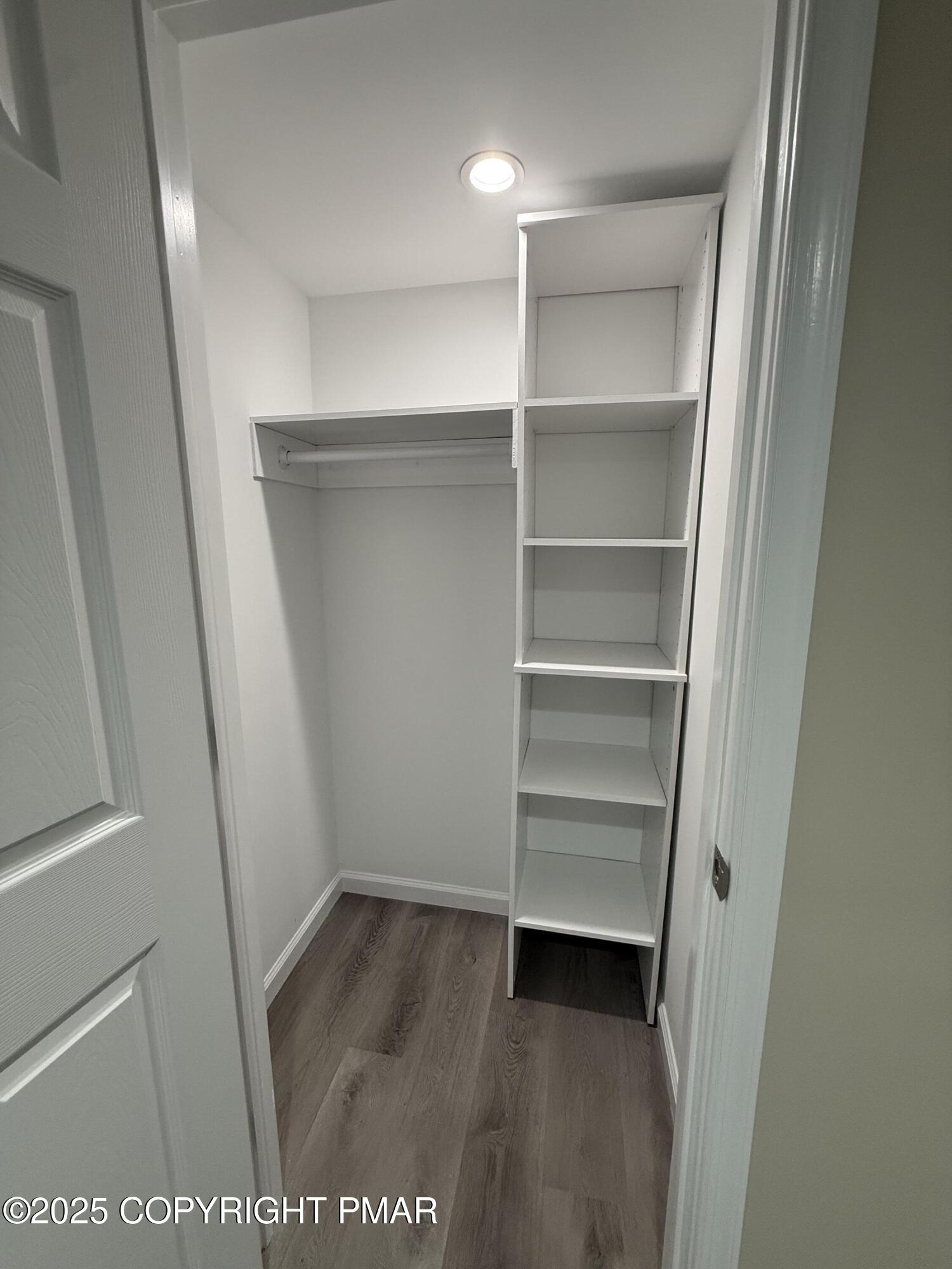 1114 Mill Street, Unit 2 Tobyhanna, PA 18466 - Photo 14 of 21 a view of walk in closet with empty racks
