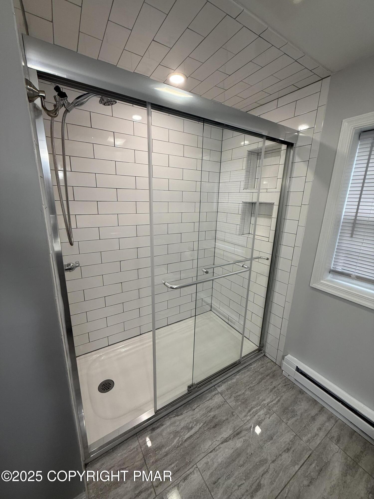 1114 Mill Street, Unit 2 Tobyhanna, PA 18466 - Photo 19 of 21 a bathroom with a glass shower door