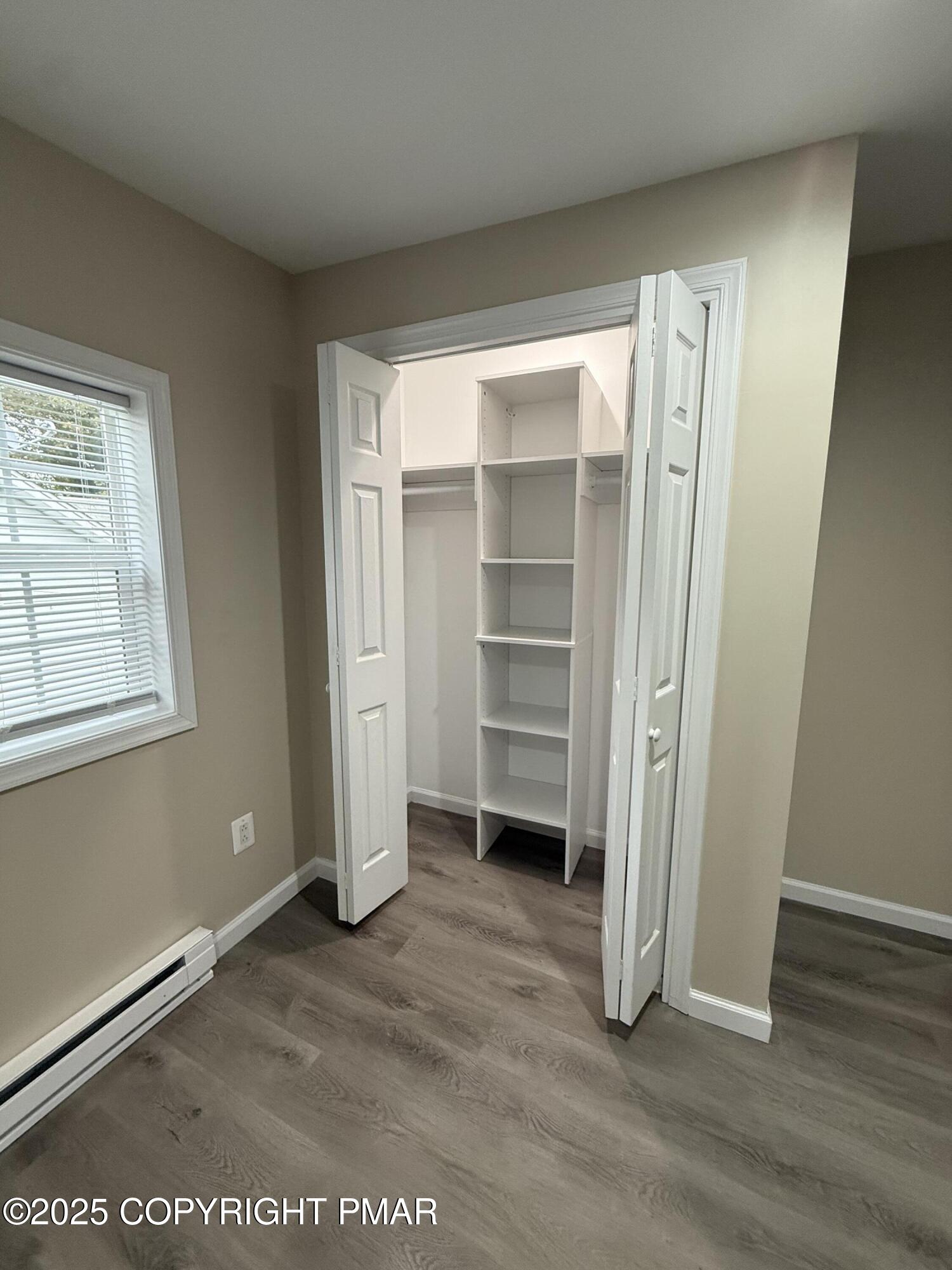 1114 Mill Street, Unit 2 Tobyhanna, PA 18466 - Photo 10 of 21 a view of walk in closet with empty racks