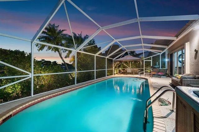 a view of a swimming pool with a porch