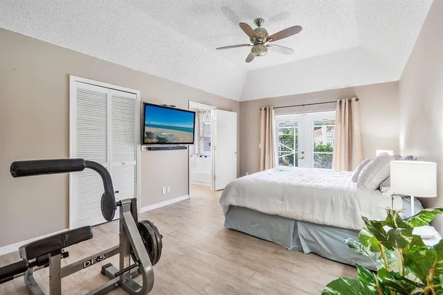 a bedroom with a bed a desk and chair