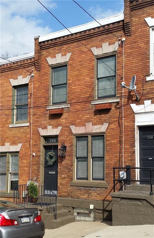 Front with newer windows & front door, new paint & plantation blinds