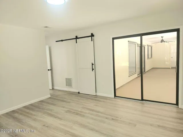 a view of entryway with wooden floor