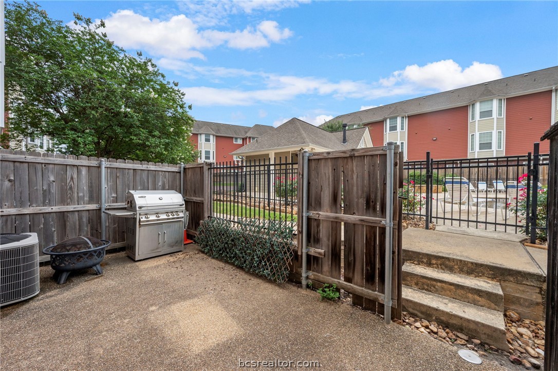 1198 Jones-Butler Road, Unit 703 College Station, TX 77840 - Photo 25 of 45 Large fenced patio, in this photo the gate is open to show access to pool.