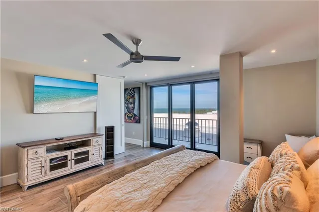 a bathroom with a granite countertop sink a mirror and shower