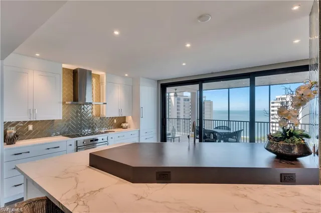 a kitchen with a table and chairs