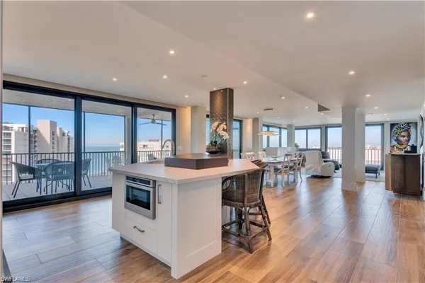 a kitchen with stainless steel appliances granite countertop a sink and cabinets