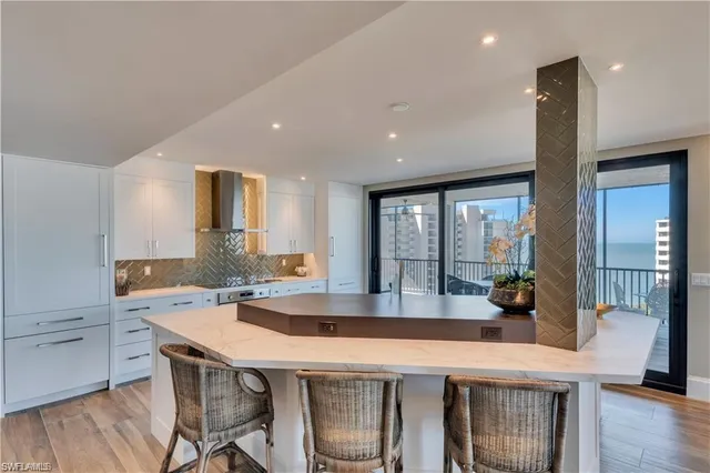 a kitchen with a table and chairs in it