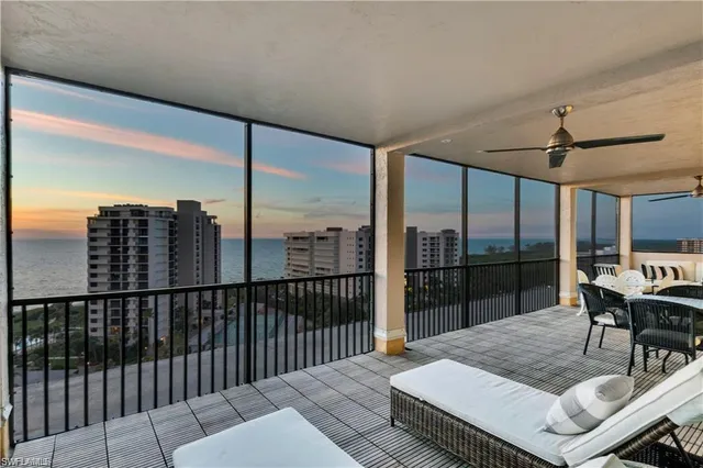 a view of a chairs and table in the balcony