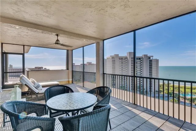 a view of a patio with a table and chairs