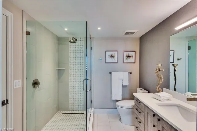 a bedroom with a large bed and a large window