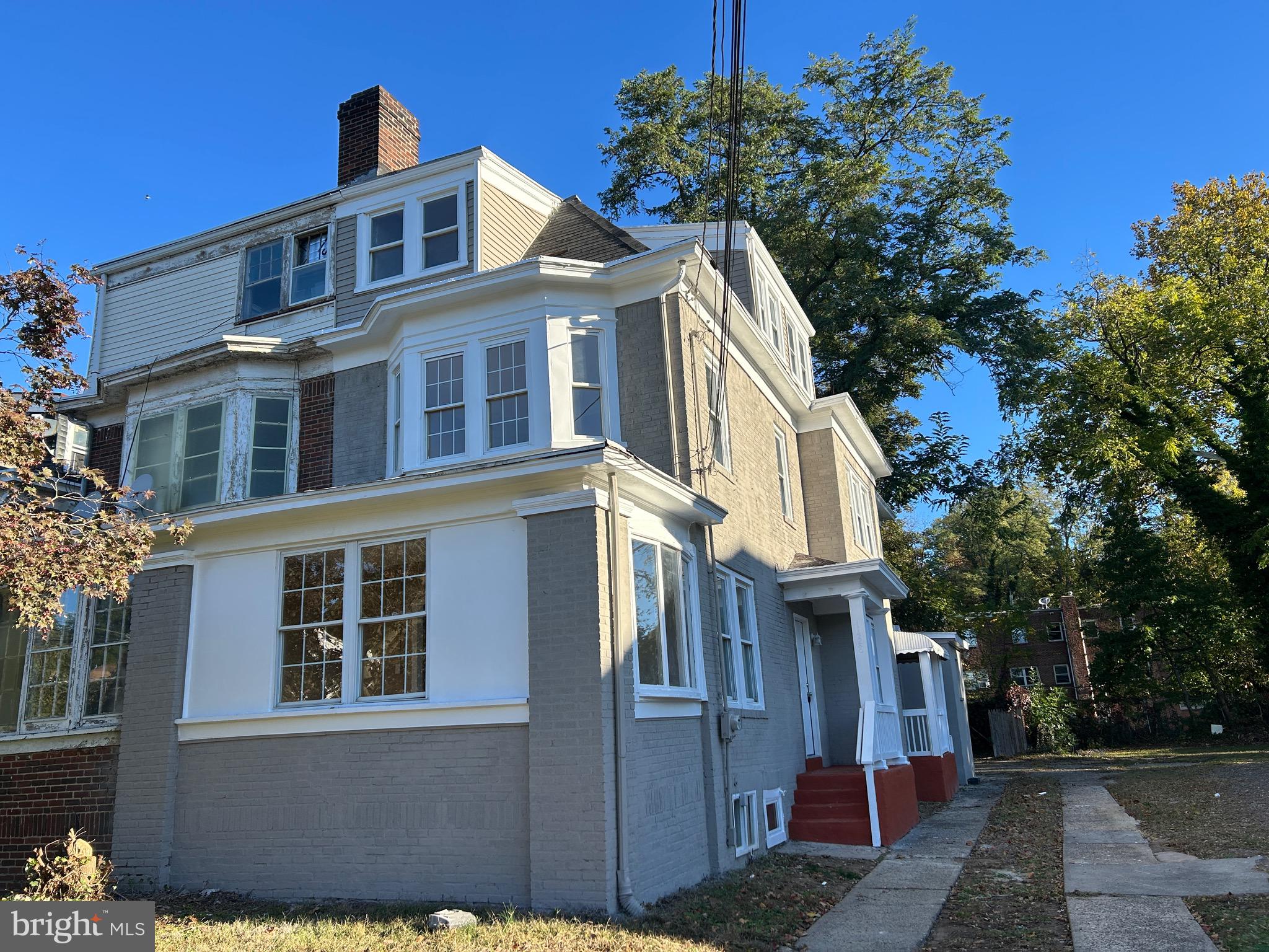 1428 West State Street Trenton, NJ 08618 - Photo 2 of 26 a front view of a house with a yard