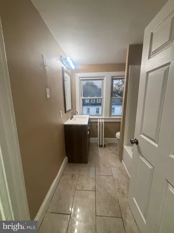 a room with a wooden floor and furniture