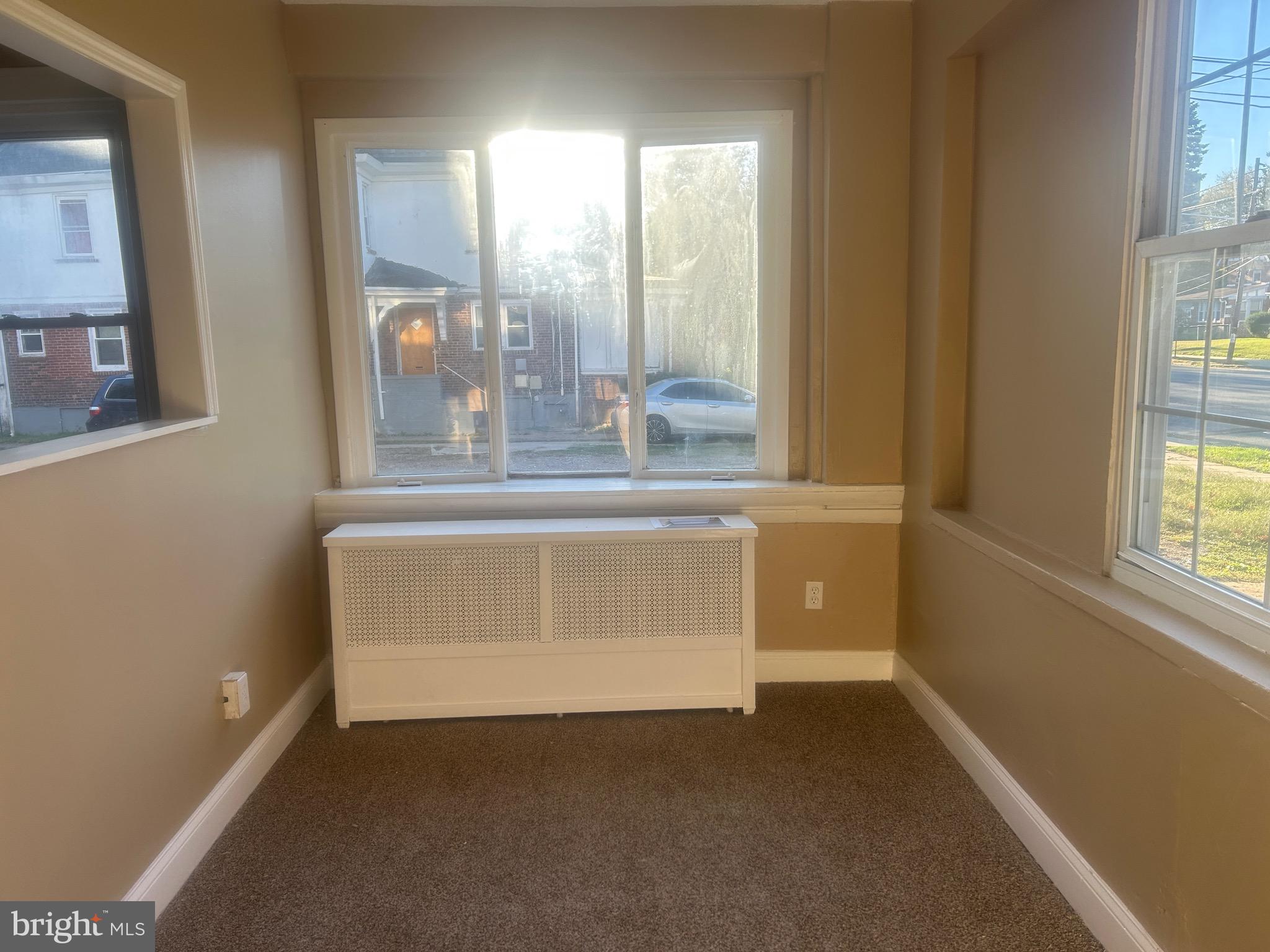 1428 West State Street Trenton, NJ 08618 - Photo 3 of 26 a view of an empty room with a window