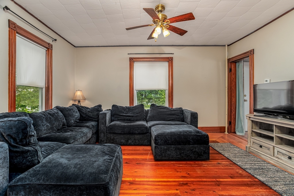 54 Charles Street Gardner, MA 01440 - Photo 13 of 40 a living room with furniture and a flat screen tv