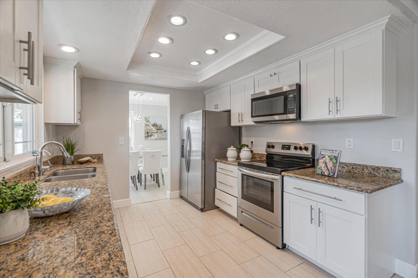 1933 Edgestone Circle San Jose, CA 95122 - Photo 12 of 40 a kitchen with stainless steel appliances granite countertop a refrigerator and a stove top oven