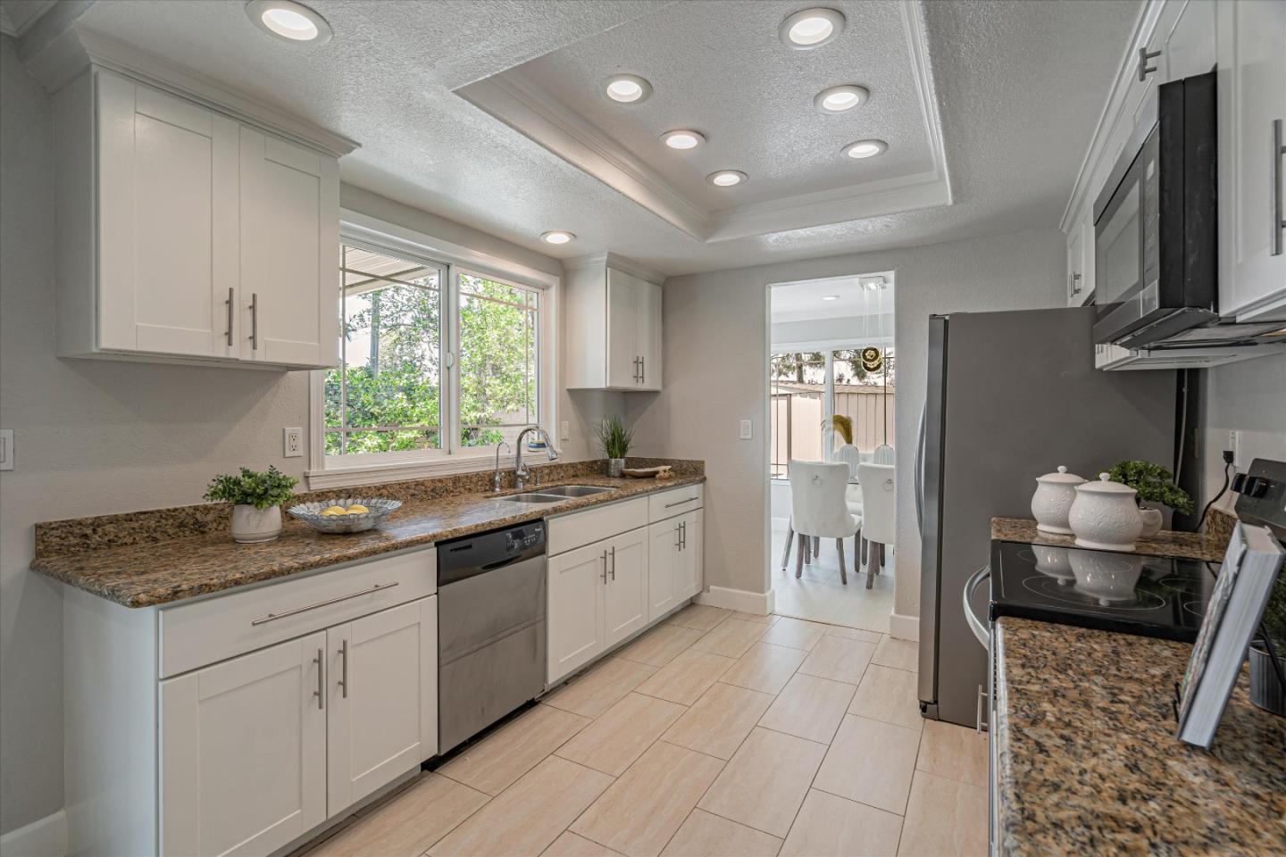 1933 Edgestone Circle San Jose, CA 95122 - Photo 13 of 40 a kitchen with stainless steel appliances granite countertop a stove sink and cabinets