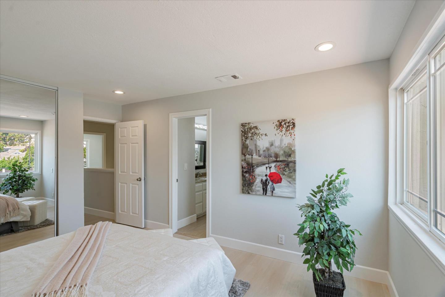 1933 Edgestone Circle San Jose, CA 95122 - Photo 28 of 40 a bedroom with a large bed and a potted plant