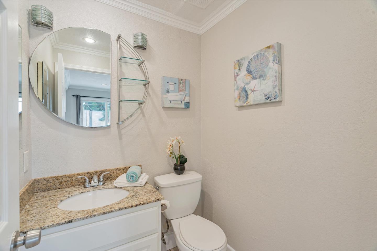 1933 Edgestone Circle San Jose, CA 95122 - Photo 29 of 40 a bathroom with a granite countertop toilet a sink and mirror