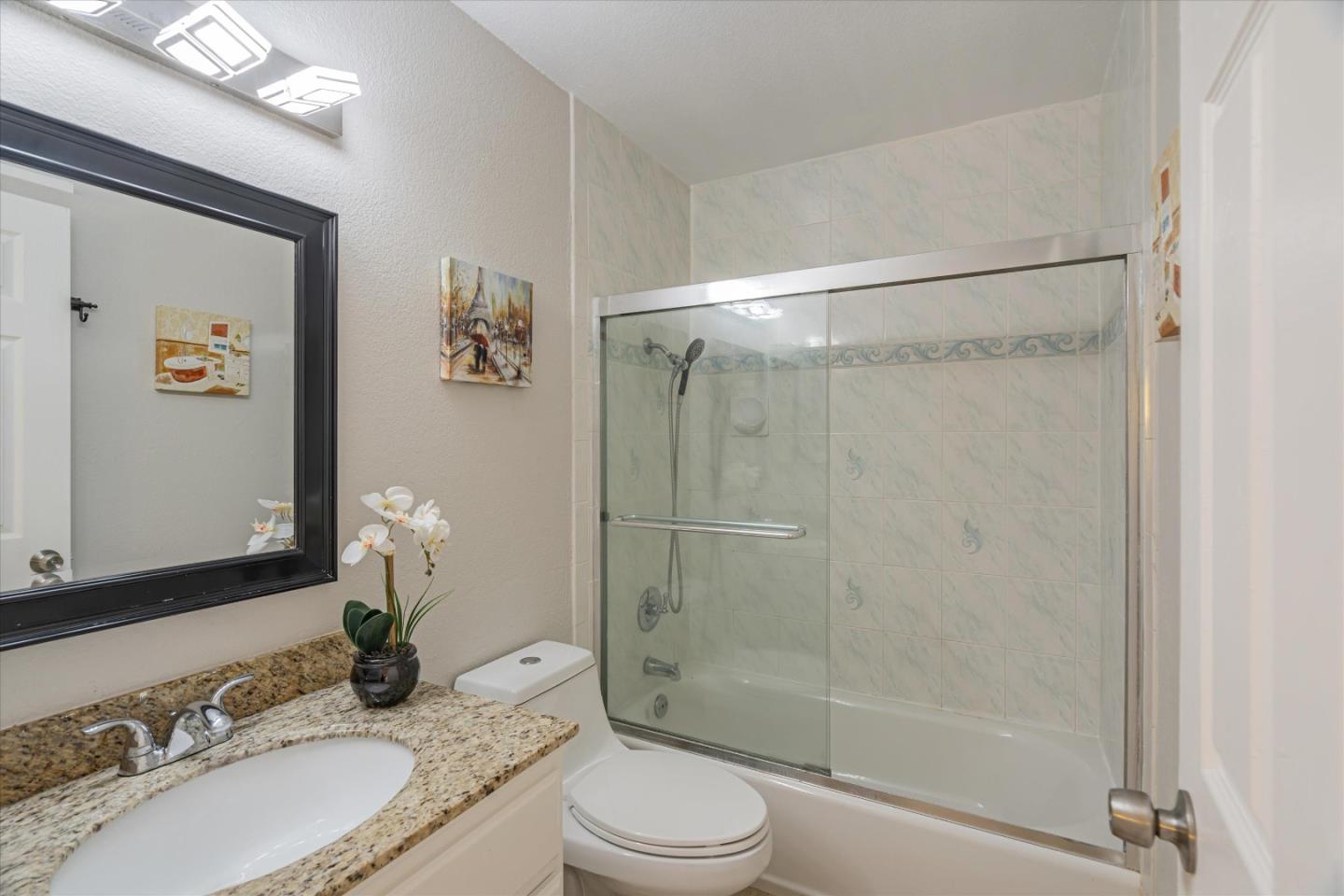1933 Edgestone Circle San Jose, CA 95122 - Photo 30 of 40 a bathroom with a granite countertop sink toilet and shower