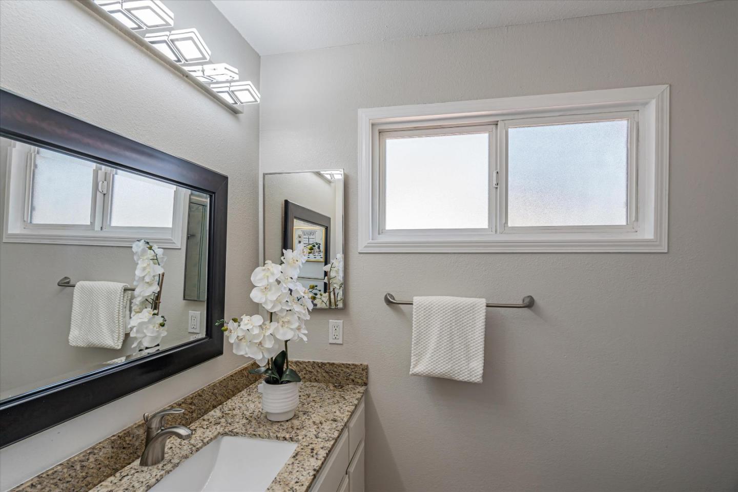 1933 Edgestone Circle San Jose, CA 95122 - Photo 31 of 40 a vase of flowers sitting on a table