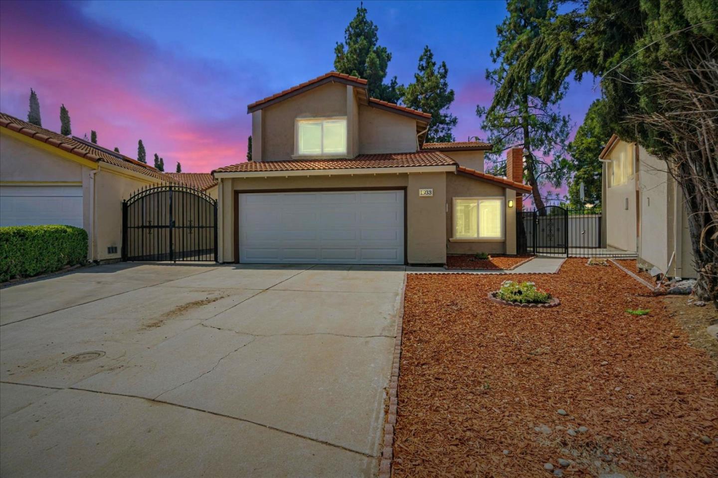 1933 Edgestone Circle San Jose, CA 95122 - Photo 40 of 40 a front view of a house with a yard and garage