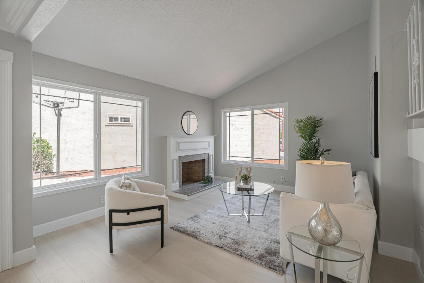 1933 Edgestone Circle San Jose, CA 95122 - Photo 8 of 40 a living room with furniture a fireplace and a table