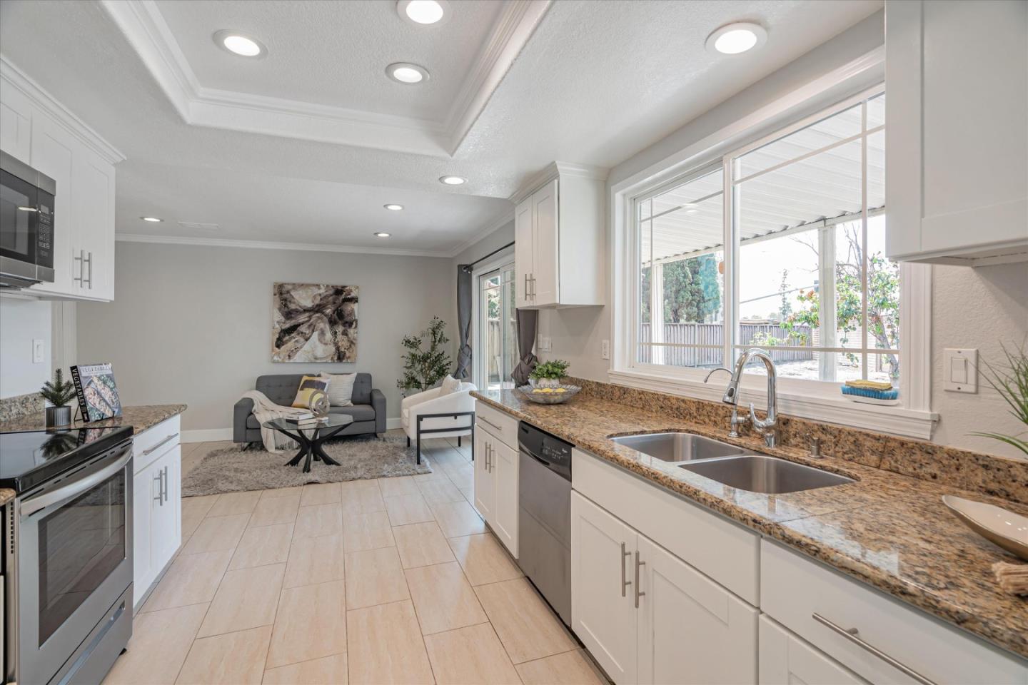 1933 Edgestone Circle San Jose, CA 95122 - Photo 10 of 40 a kitchen with granite countertop a sink and a stove top oven