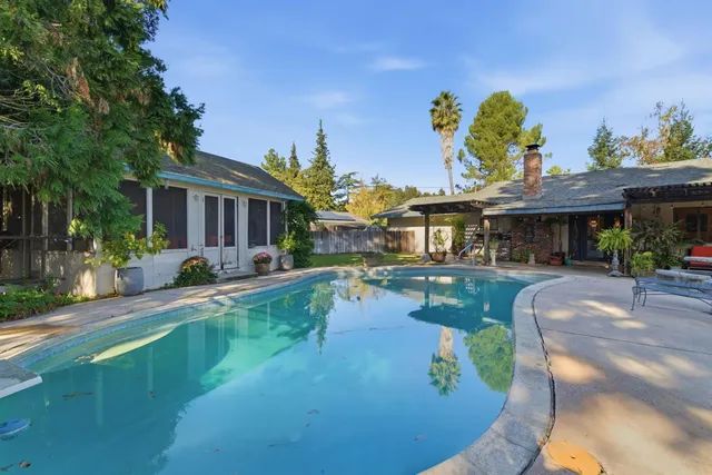 a view of a house with swimming pool