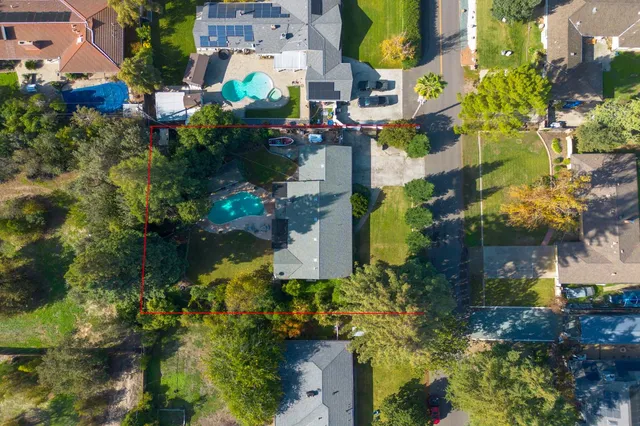 an aerial view of residential houses with outdoor space