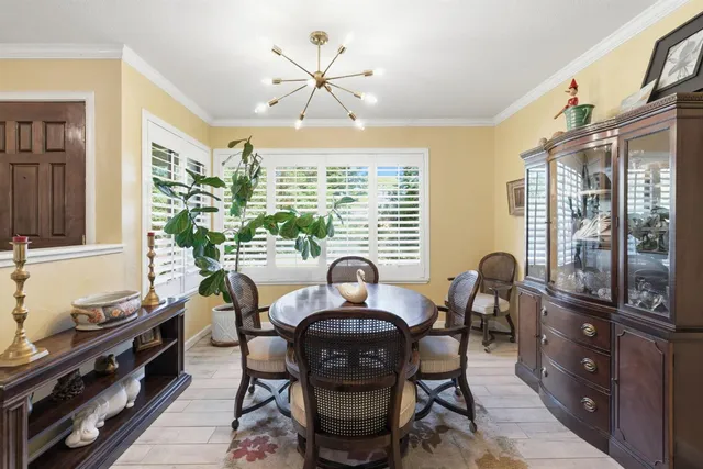 a view of a dining room with furniture window and outside view