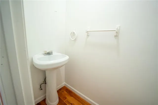 a bathroom with a sink and mirror