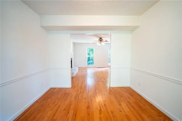 a view of a room with wooden floor