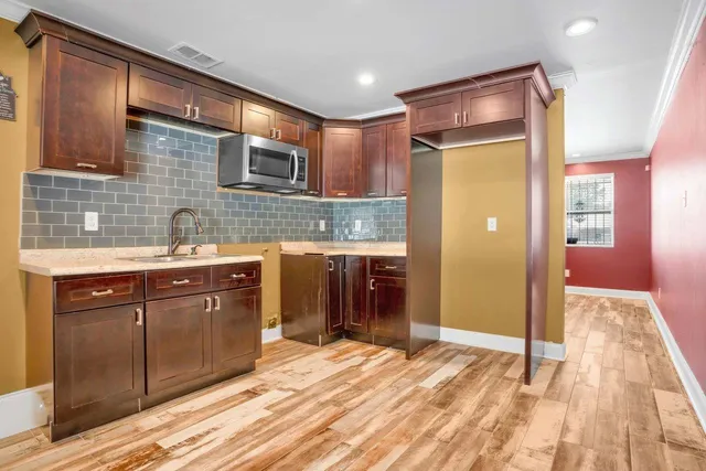 a bathroom with a sink mirror toilet and bathtub