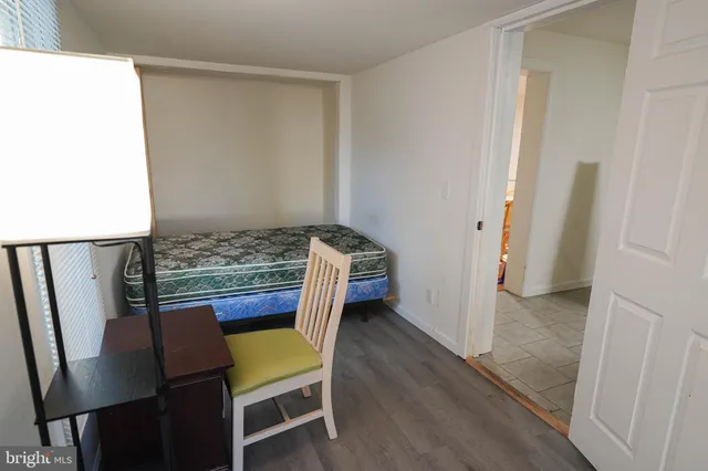 a bedroom with a bed and a table in it