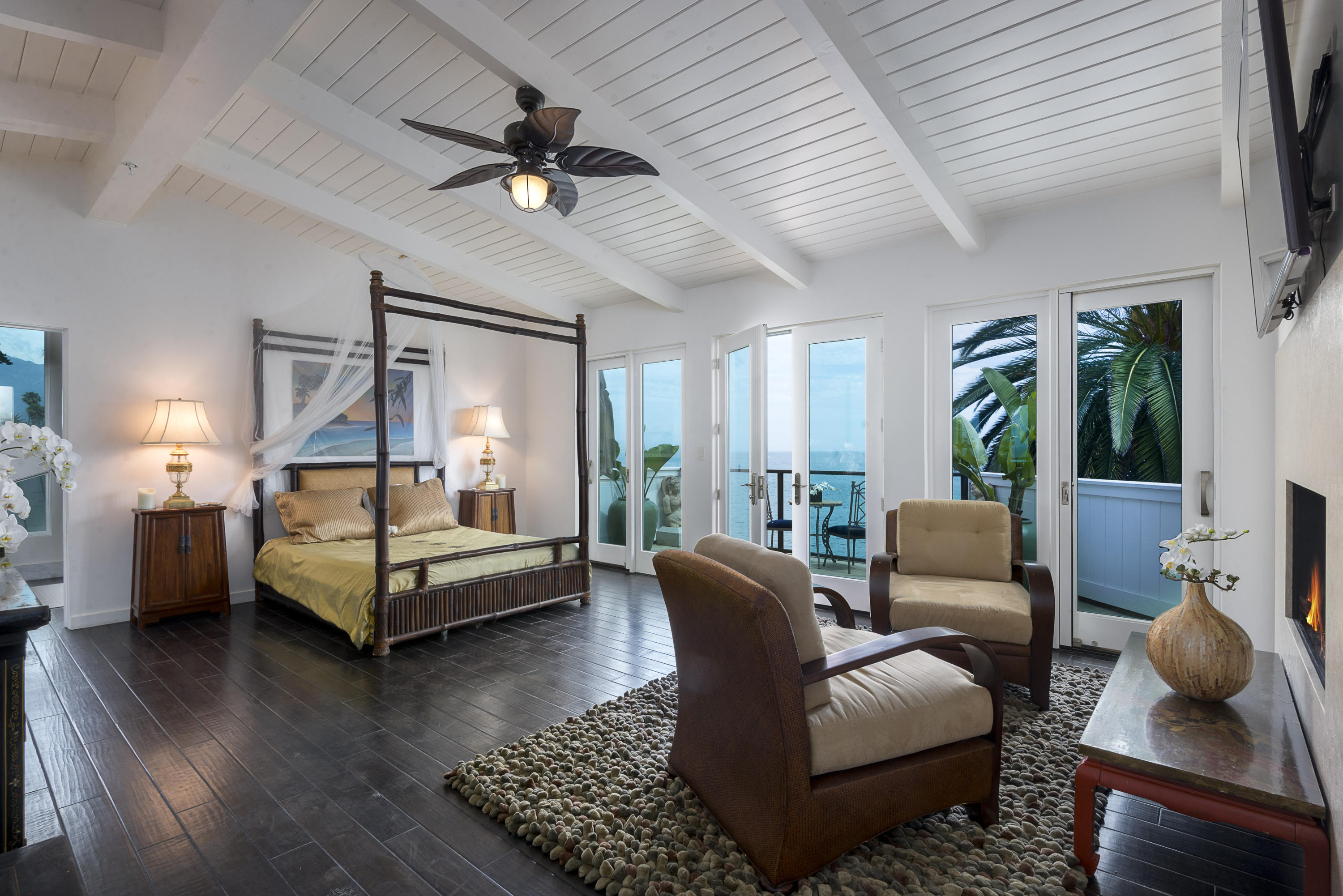 1491 Edgecliff Lane Montecito, CA 93108 - Photo 18 of 28 a bedroom with furniture wooden floor and a rug