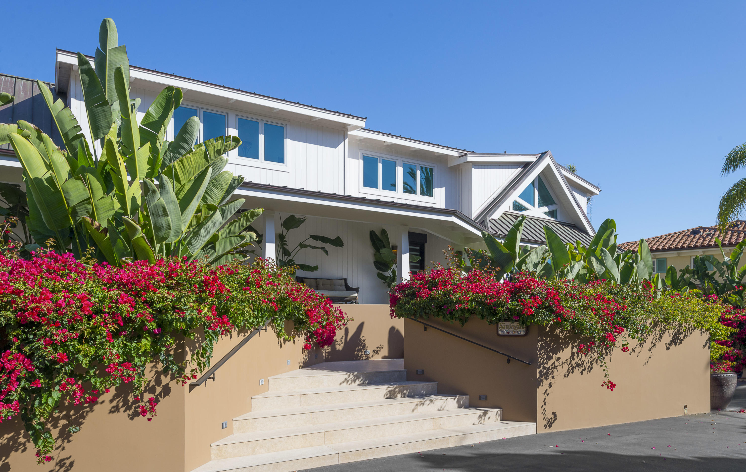1491 Edgecliff Lane Montecito, CA 93108 - Photo 9 of 28 a view of a house with a lot of flower plants