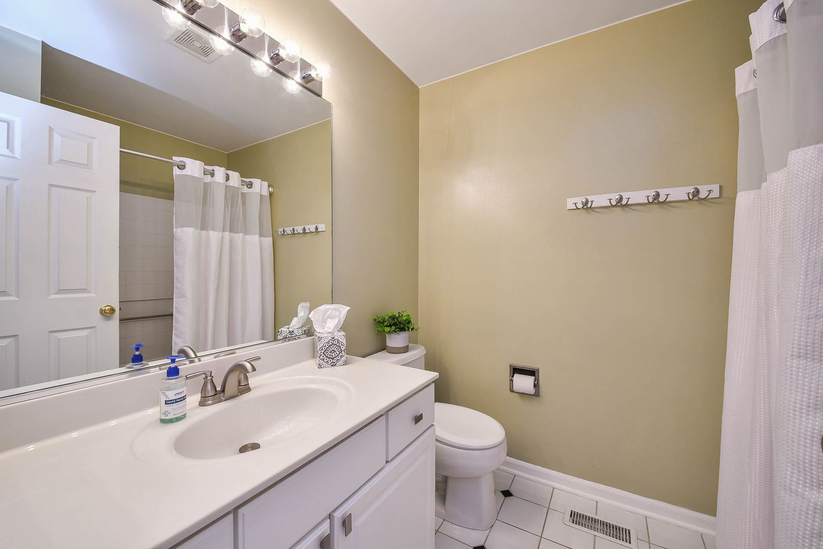 1772 Ellington Drive Aurora, IL 60503 - Photo 20 of 24 a bathroom with a sink a toilet and shower