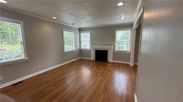 a kitchen with stainless steel appliances granite countertop a refrigerator a sink and wooden cabinets