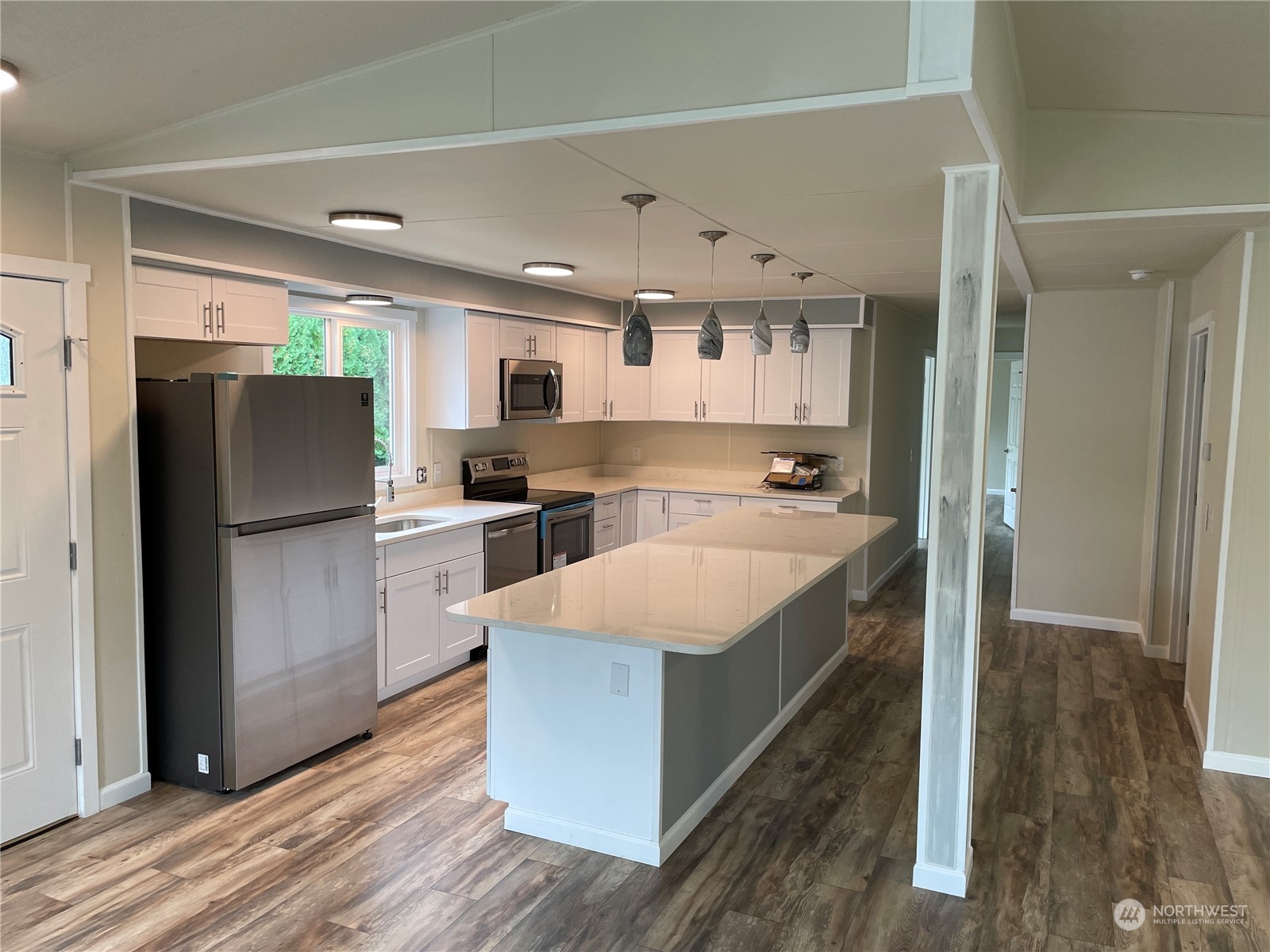 201 Union Avenue Southeast, Unit 134 Renton, WA 98059 - Photo 5 of 20 a large kitchen with a refrigerator a sink and dishwasher