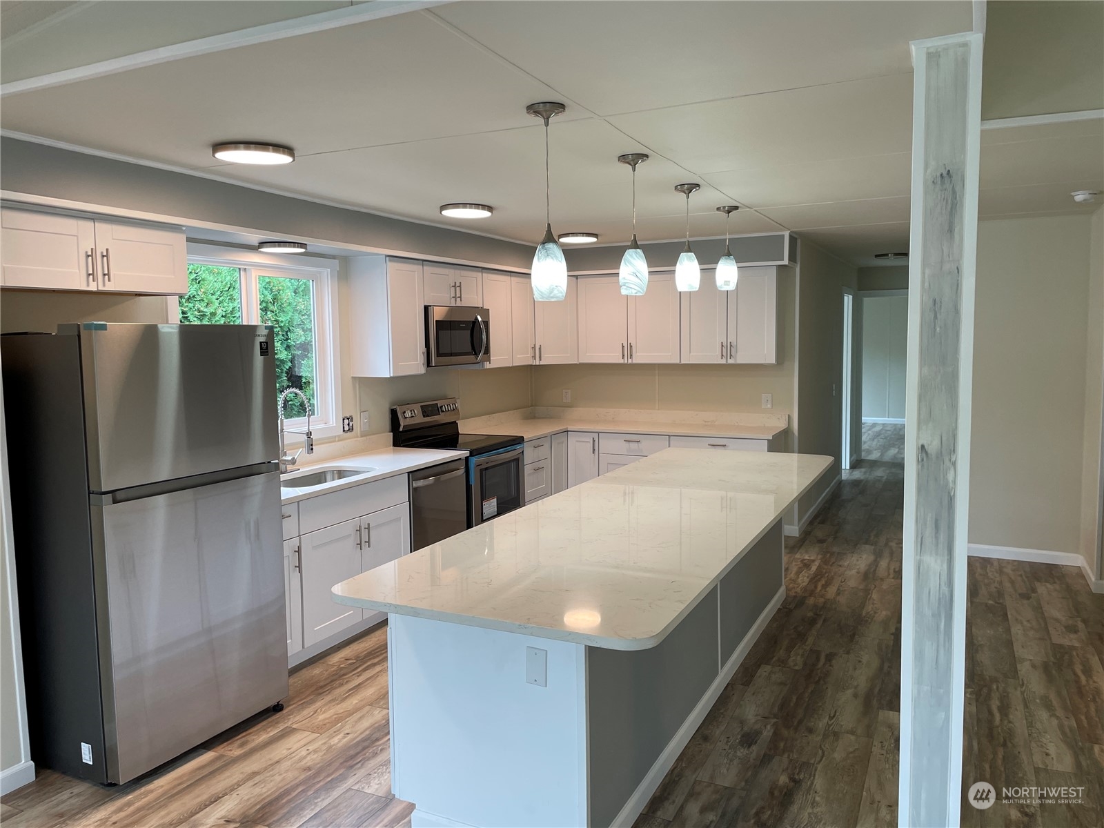 201 Union Avenue Southeast, Unit 134 Renton, WA 98059 - Photo 9 of 20 a kitchen with a refrigerator a sink and dishwasher